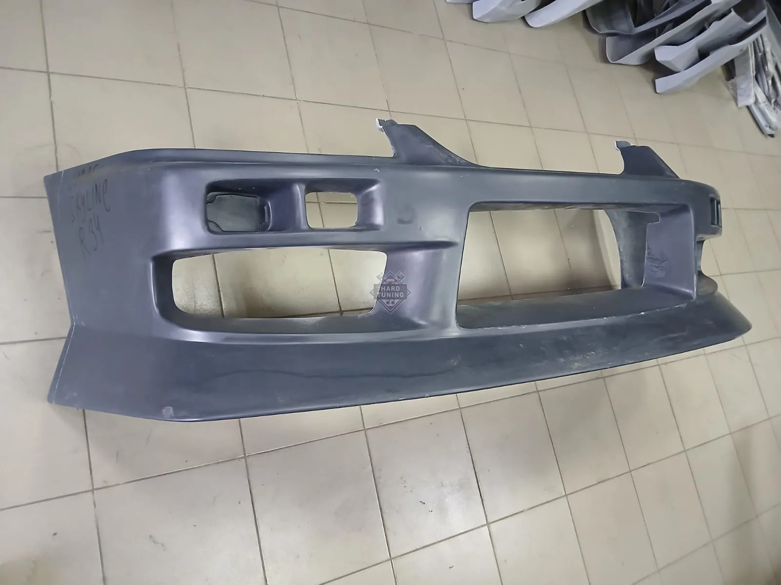 Передний бампер URAS Nissan Skyline R34