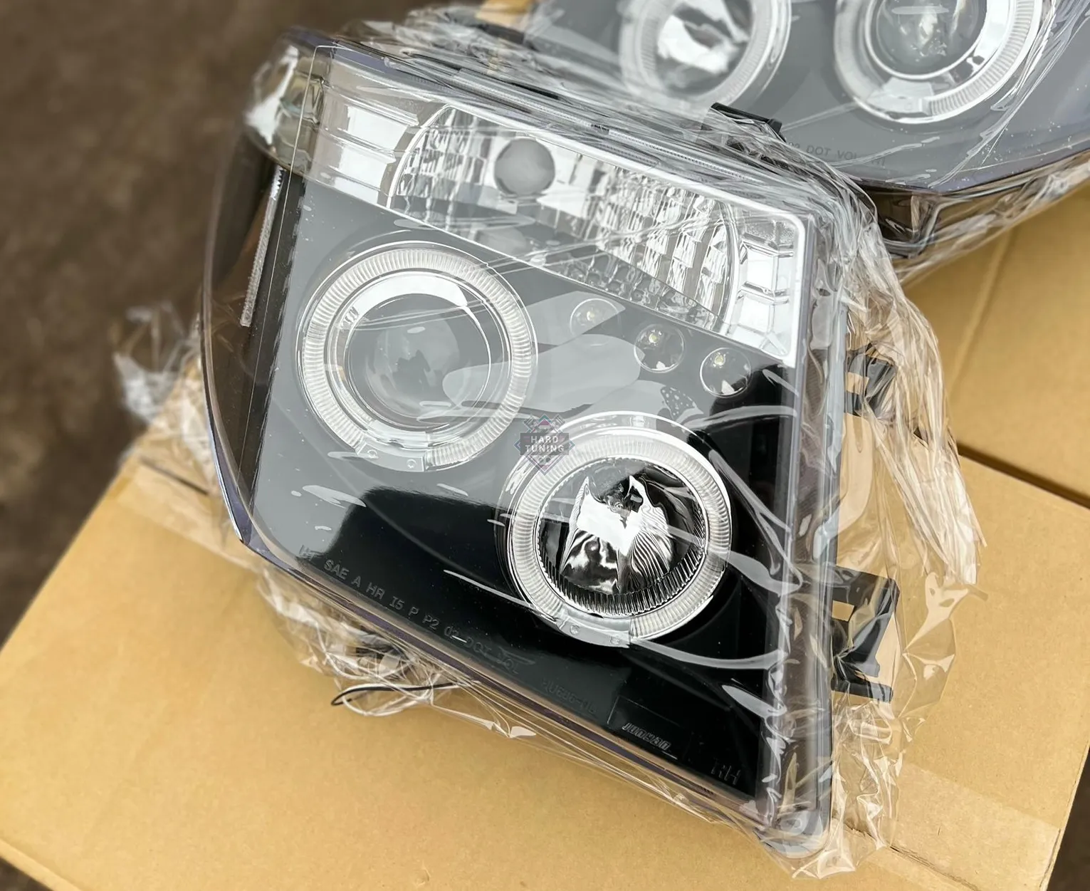 Передние фары Nissan Navara D40 / Pathfinder (2005-2010) Angel Eyes черные