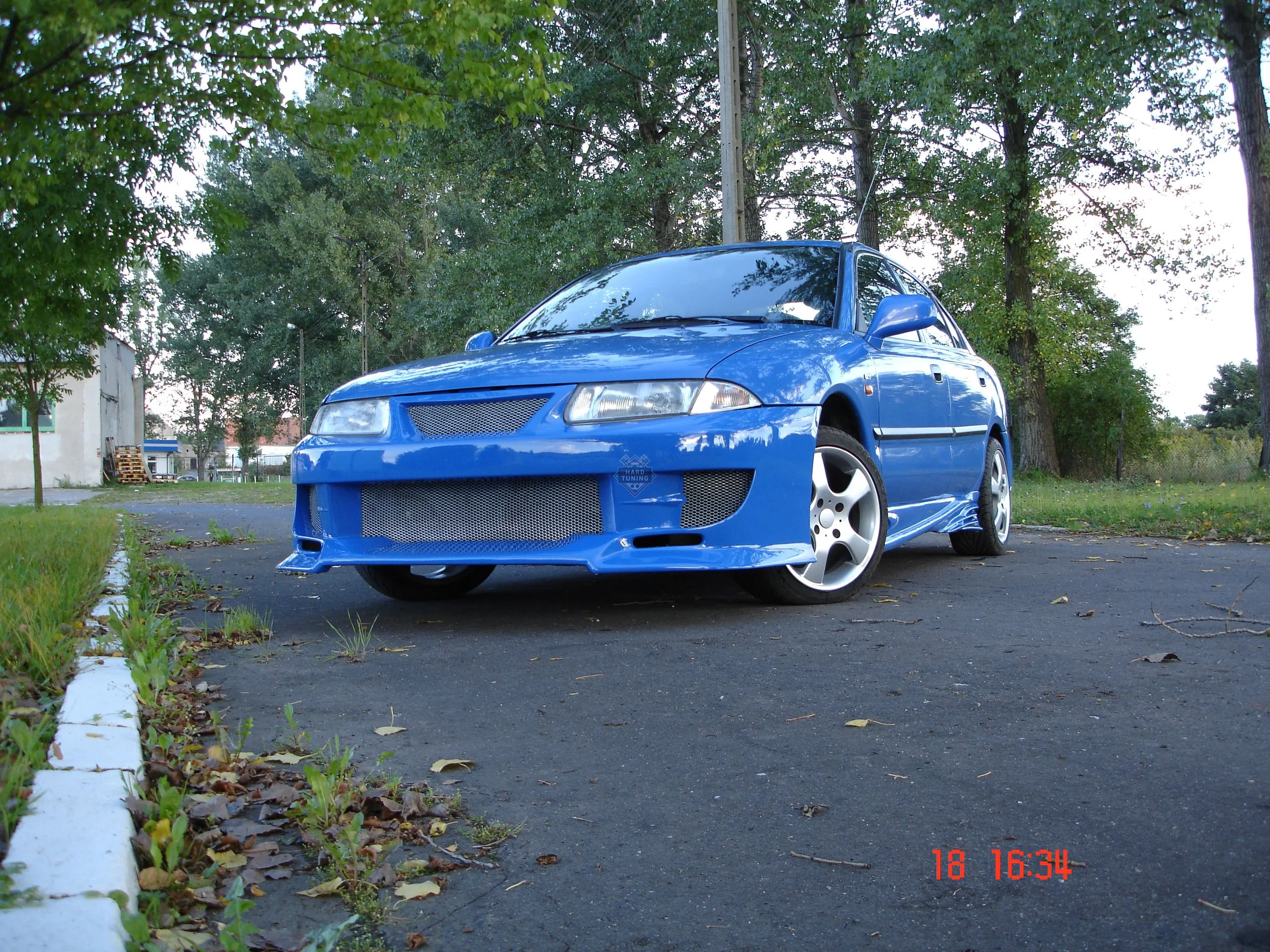 Передний бампер Auto R Mitsubishi Carisma 1995-2000