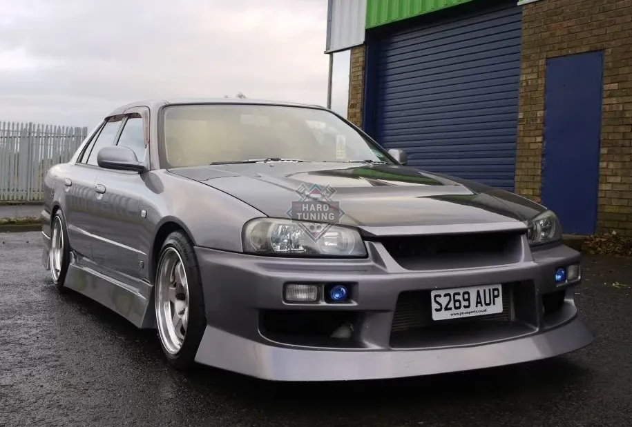 Передний бампер URAS Nissan Skyline R34