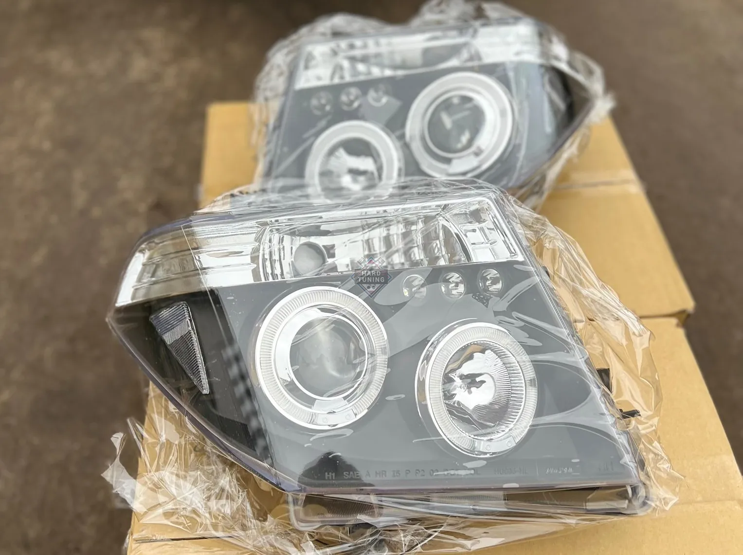 Передние фары Nissan Navara D40 / Pathfinder (2005-2010) Angel Eyes черные