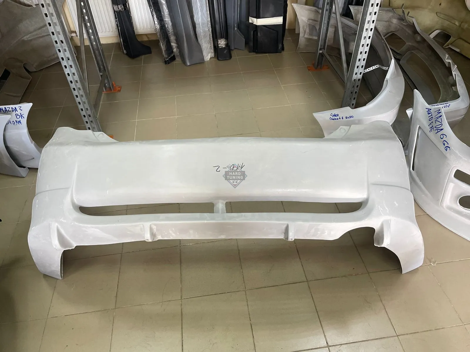 Задний бампер Toyota Corolla E140/E150 дорестайлинг