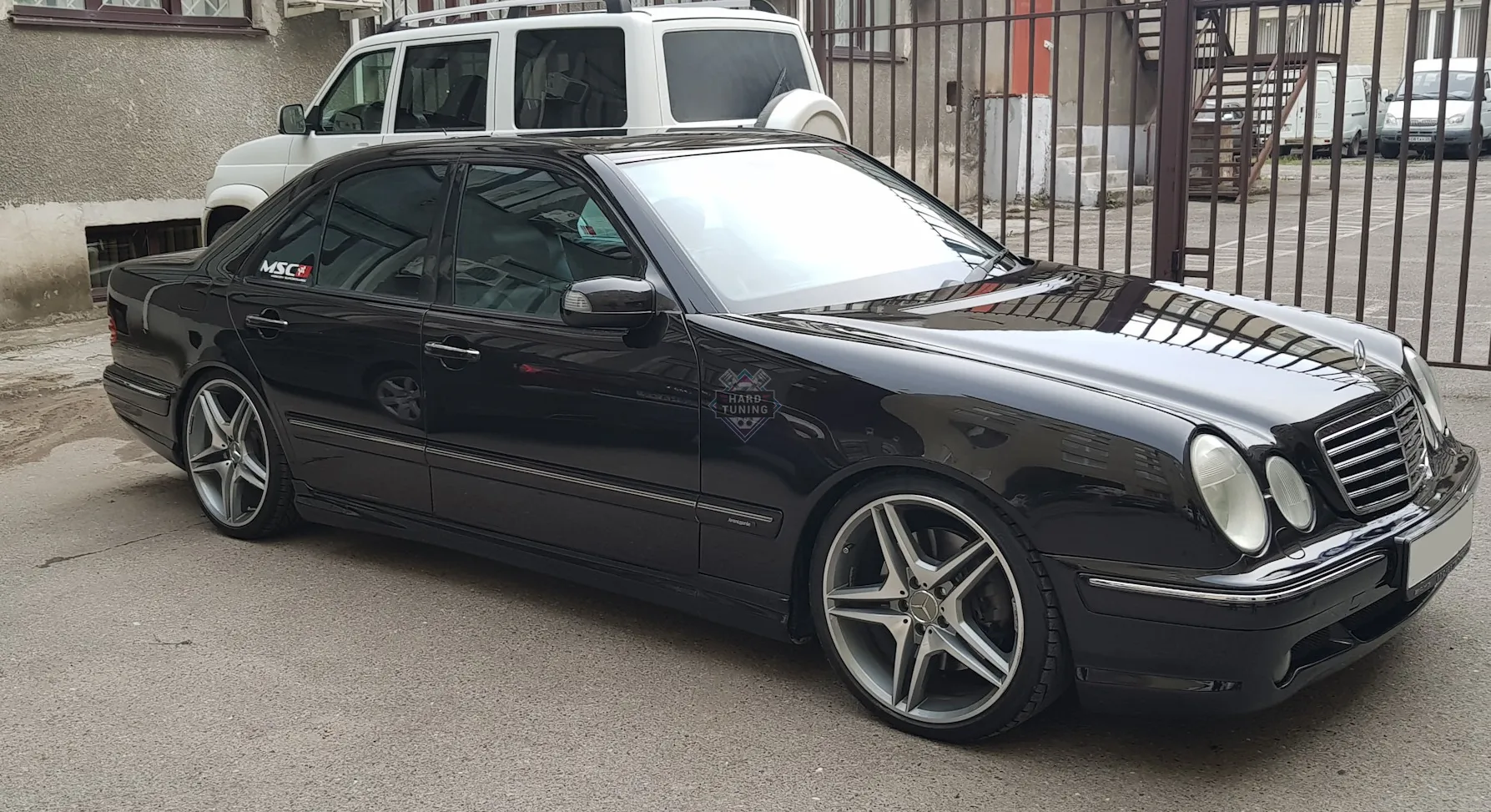 Передний бампер AMG 55 Mercedes E-Class W210 рестайлинг
