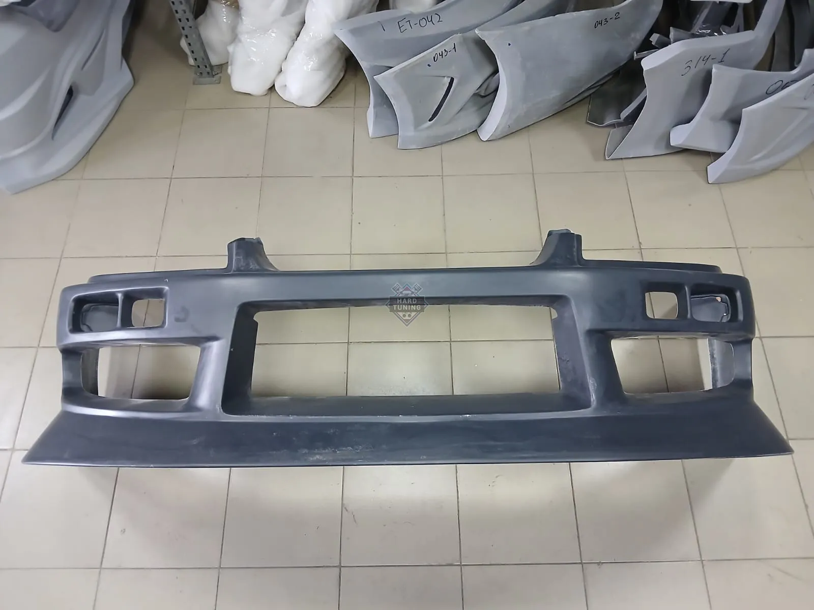 Передний бампер URAS Nissan Skyline R34