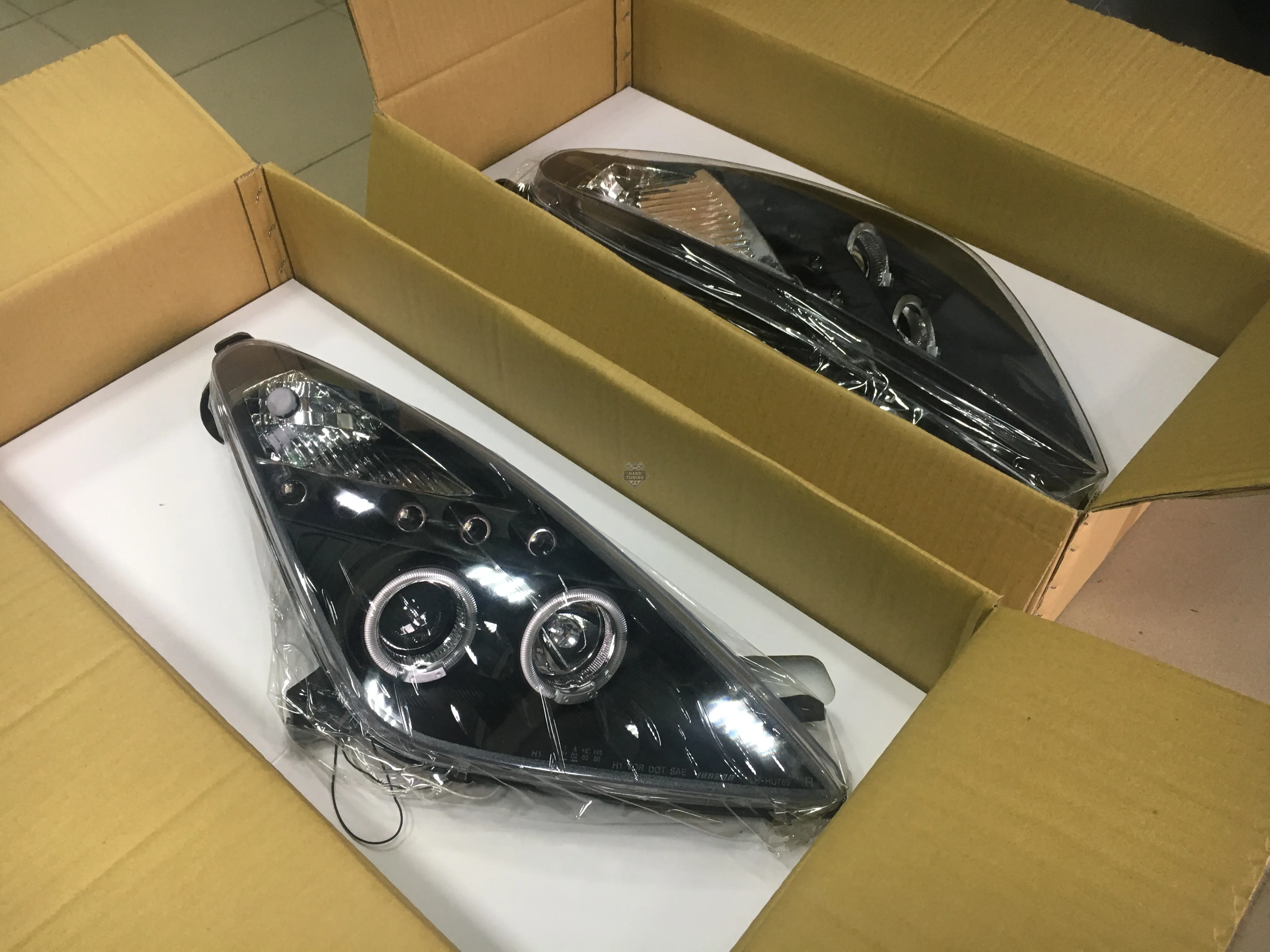 Передние фары Toyota Celica T230 (1999-2005) Angel Eyes черные