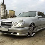 Передний бампер AMG 55 Mercedes E-Class W210 дорестайлинг