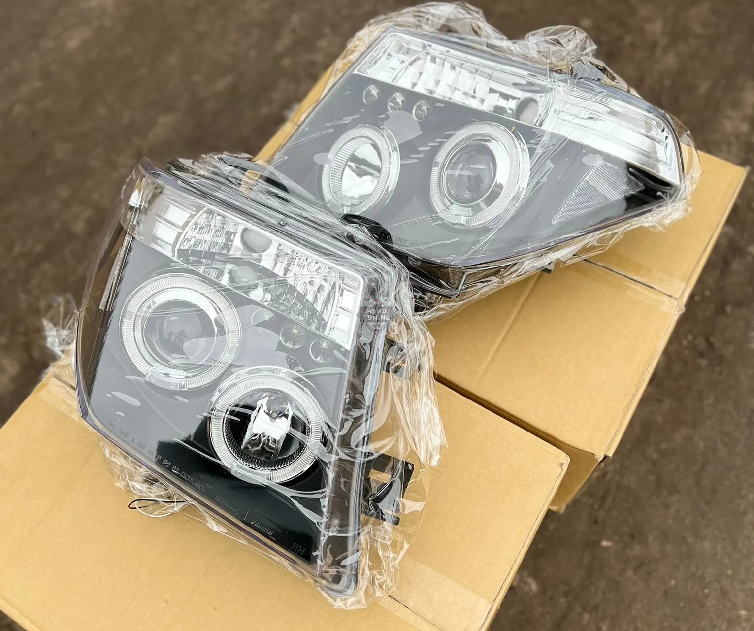 Передние фары Nissan Navara D40 / Pathfinder (2005-2010) Angel Eyes черные