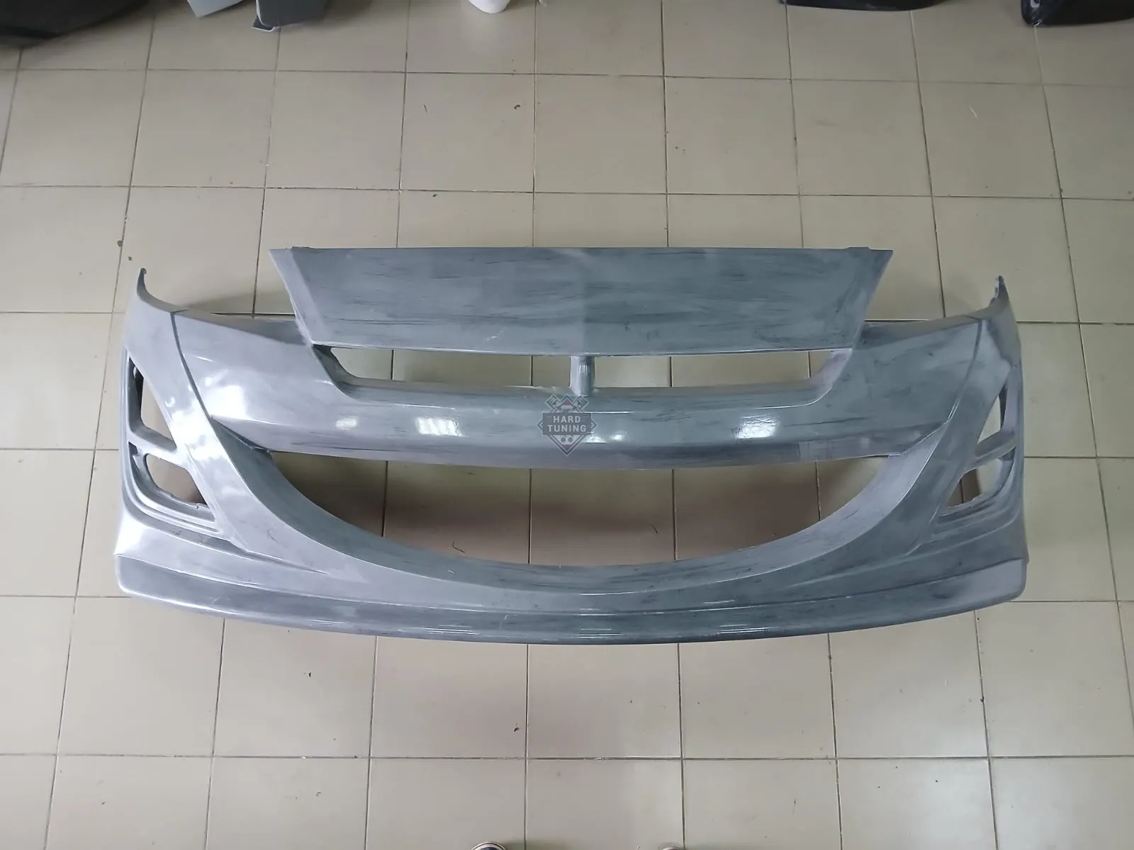 Передний бампер AUTOEXE Mazda 3 BL седан / хетчбек