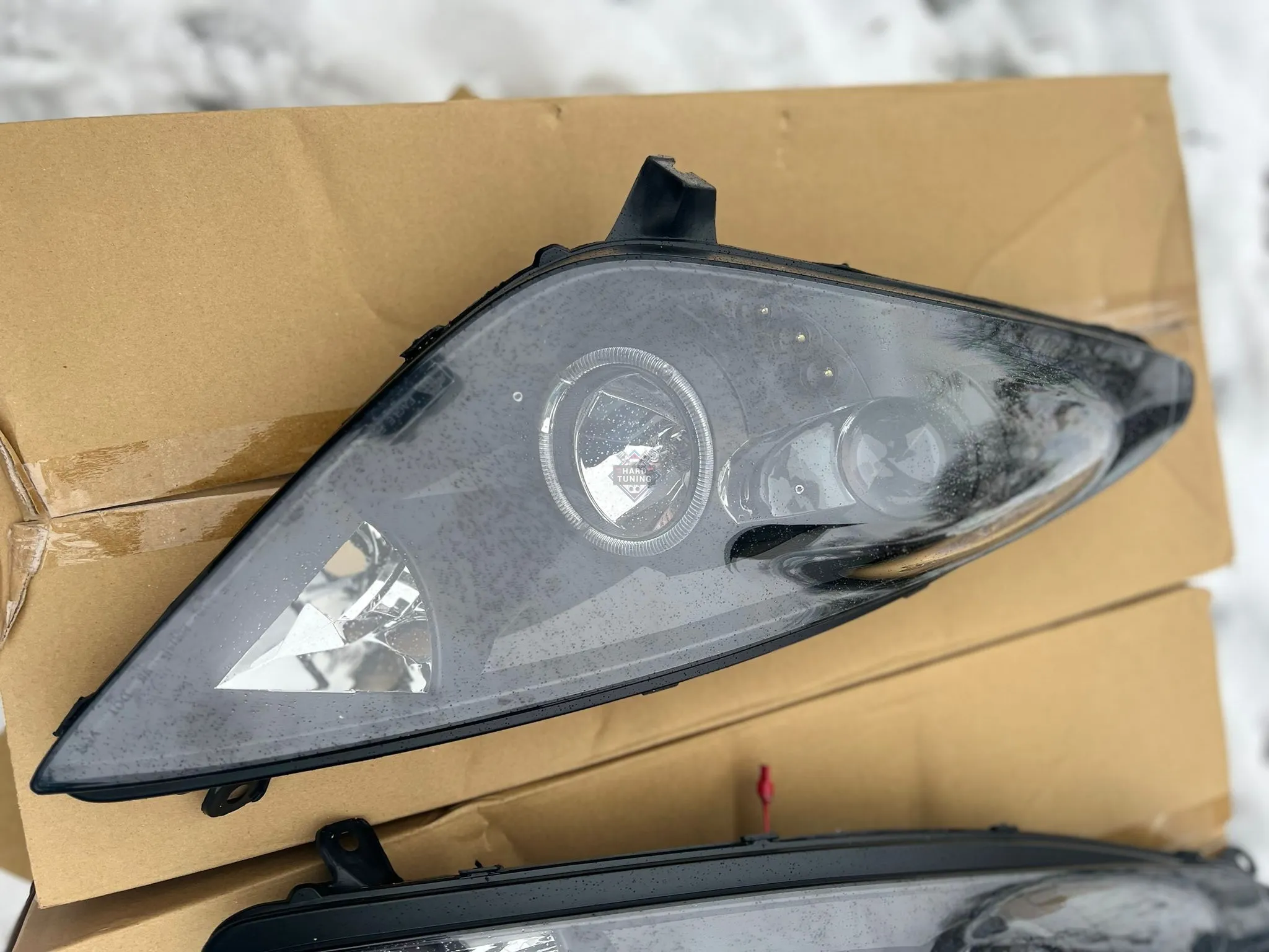 Передние фары Toyota Celica T230 (1999-2005) Angel Eyes черные