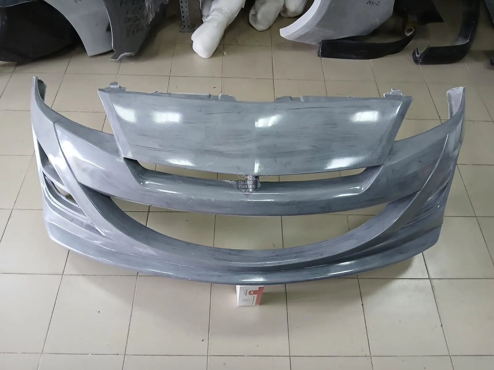 Передний бампер AUTOEXE Mazda 3 BL седан / хетчбек