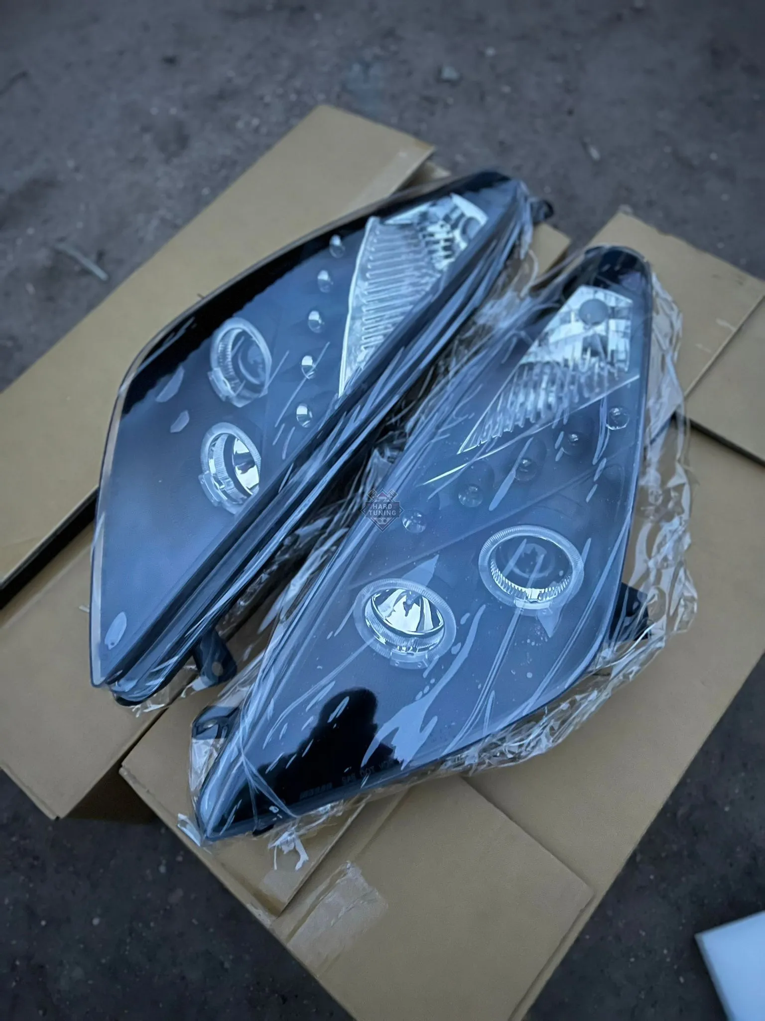 Передние фары Toyota Celica T230 (1999-2005) Angel Eyes черные